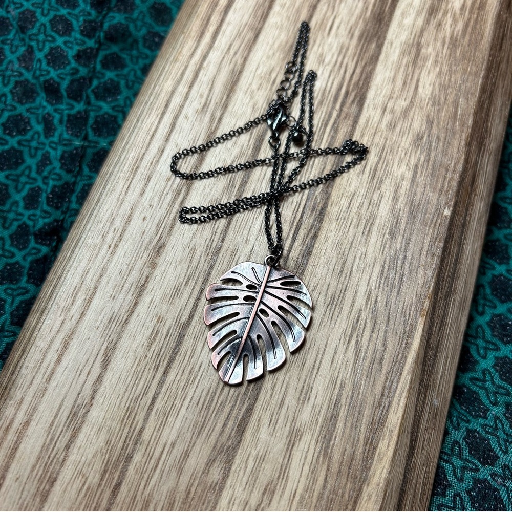 Copper Look Monstera Pendant Necklace Black Chain